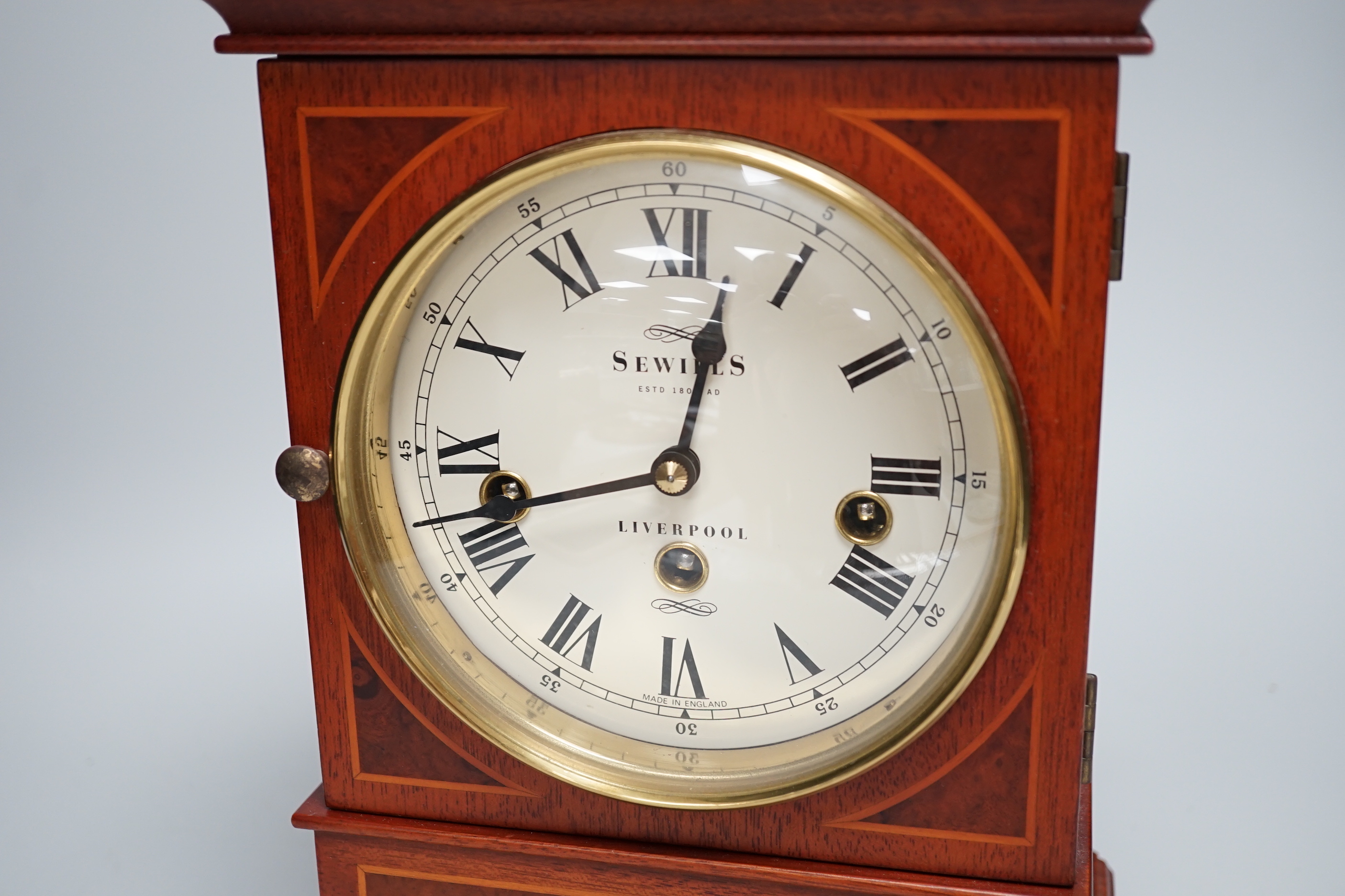 Sewills, Liverpool. An inlaid mantel clock with three train balance escapement movement, chiming on eight gongs, 37cm high